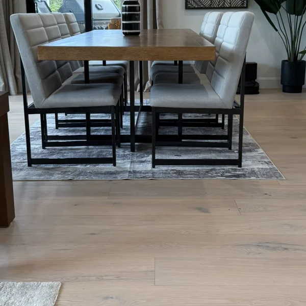 Dining table and chairs on top of hardwood floors