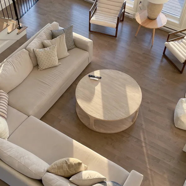 Living room with large sectional couch on hardwood floors