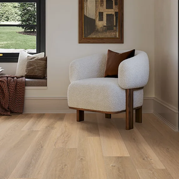 Living room with chairs and sectional couch on hardwood floors